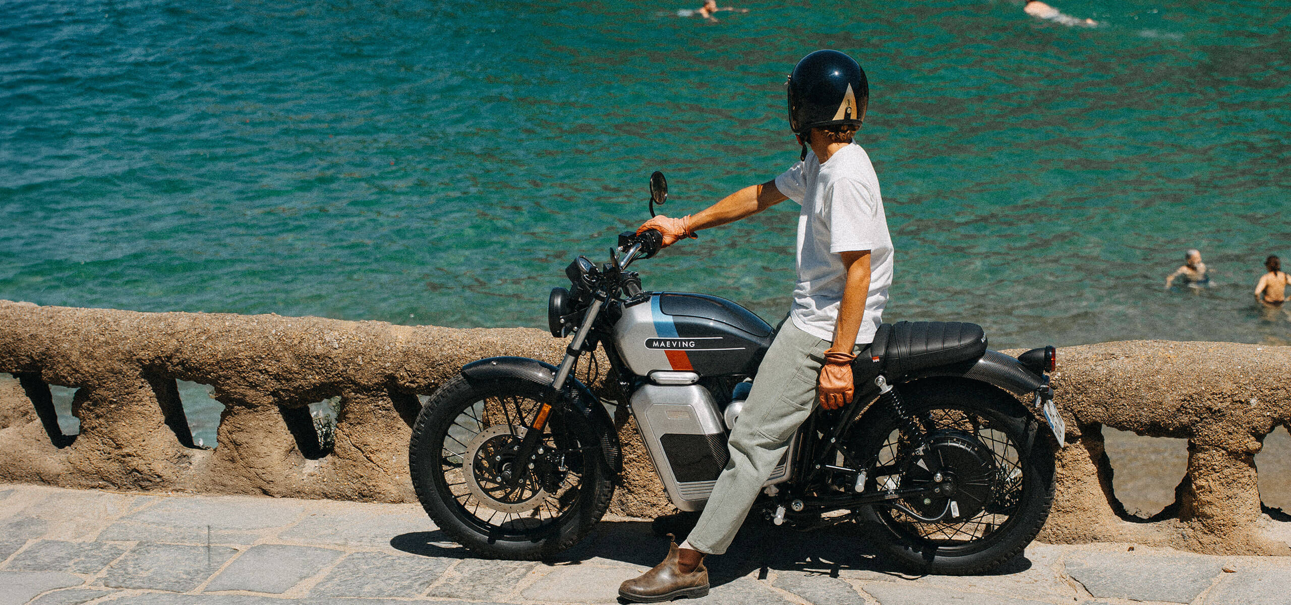 Maeving electric motorcycle rider on open road